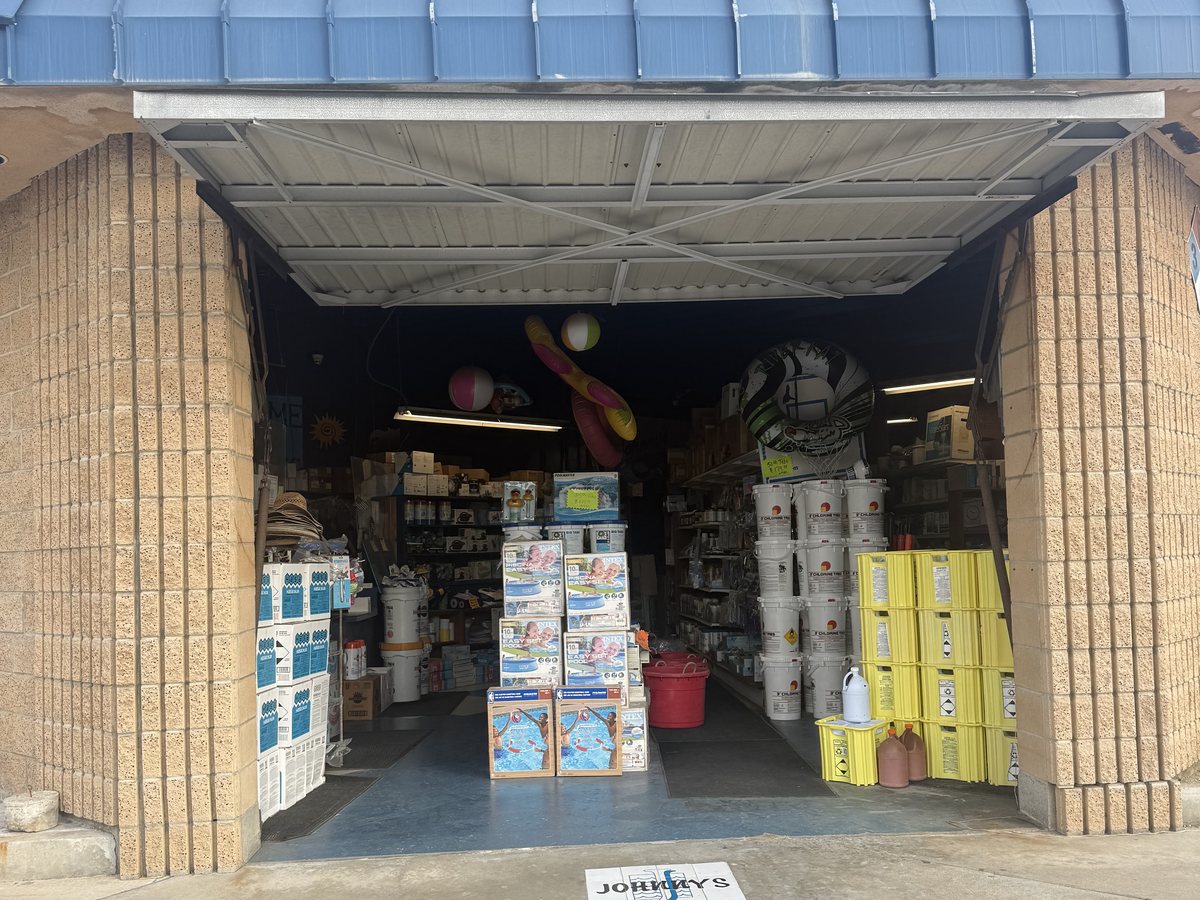 The open bay door and sales floor at Johnny's in Covina