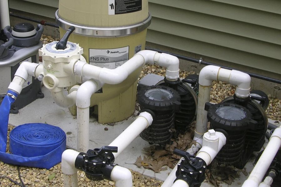 Pentair filter and pool pumps on an equipment pad during a repair